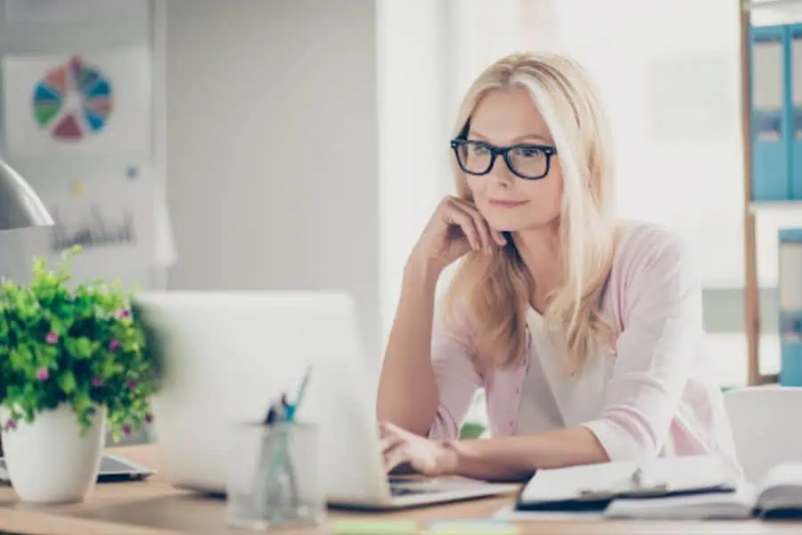 A woman looks attentively while typing on her laptop at her work desk. This could represent the convenience offered by online therapy in Seattle, WA. Learn more about online therapy for depression in Seattle, WA, and the support an online therapist in Seattle, WA can offer.