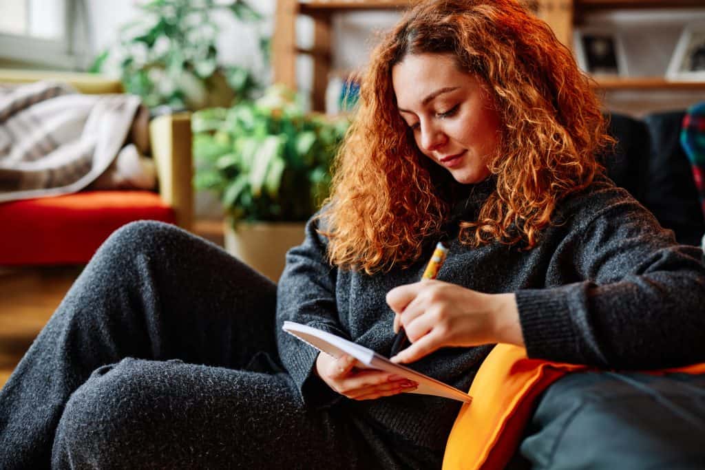 Woman practicing bottom up and top down approaches they learned during online therapy