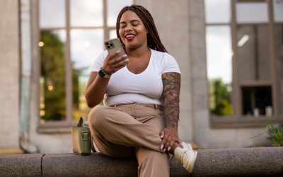 Black woman having online therapy session call on smartphone